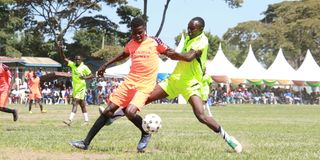 Segera FC’s Kelvin Kagiri (left) vies with Bridge Commandos' Isaac Ngigi