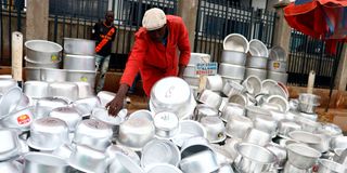 Byron Muga sells sufurias in Gikomba market in Nairobi.