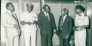 Then President Daniel Arap Moi and Director of Intelligence Mr James Kanyotu