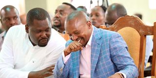 Interior CS Prof Kithure Kindiki chats with Mbeere North MP Geoffrey Ruku.