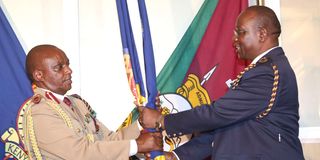 Former Inspector General of Police David Kimaiyo handing over duty to Deputy IG Samuel Arachi in acting capacity