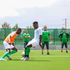 Moses Shumah (left)vies for the ball with Amos Nondi