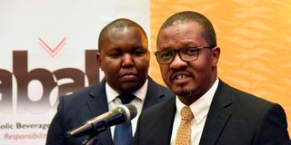 EABL Corporate Relations Director Eric Kiniti and Alcoholic Beverages Association of Kenya (ABAK) chairman Eric Githua