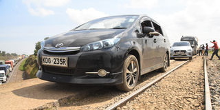 Motorists seek a way out via the railway line