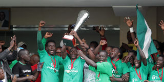 Gor Mahia players celebrate with the trophy