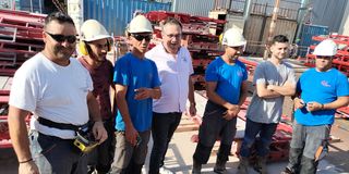 French fabrication company Comat Coffrages’ head Florian Bernard and other staff
