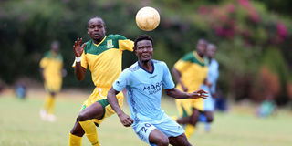 Mara Sugar forward James Olweny vies for the ball with Mathare United defender Tony Odhiambo