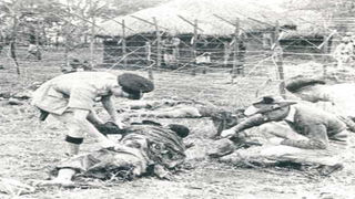 British soldiers arresting Mau Mau fighters.