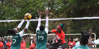 Yvonne Sinaida (right) of Kenya Pipeline attacks against Damaris Sang (left) and Naomi Chelimo of Kenya Army