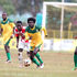Mathare United's Christian Kitamba dribbles past Mully Children Family's Kelvin Omondi 
