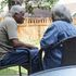 Happy eldery black couple talking in the backyard