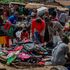 Parents buy second hand school bags by the roadside