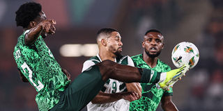 Nigeria's defender Ola Aina (left) vies for the ball