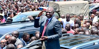 President William Ruto acknowledges greetings from members of the public in Homa Bay town
