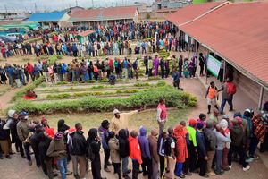 Kenyan voters wait in line to cast their ballots on August 9, 2022.