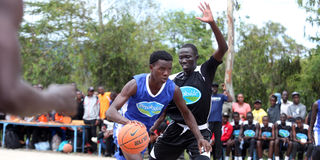 Laiser Hill Academy's Kevin Mugusha (left) vies Lukenya Academy's Dominic Tong