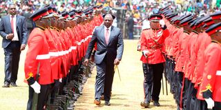 President Dr William Ruto inspects a guard of honour during the Mashuja Day celebrations