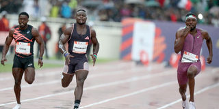 Kenya's Ferdinand Omanyala (centre) takes on USA's Kenny Bednarek