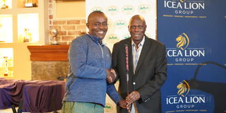 ICEA LION Group Chairman Joe Wangai awards the winner of Patron's Putter Gregory Mburu