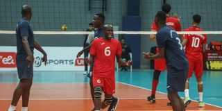 Kenya Prisons libero Peter Kibata (centre) leads his teammates in celebration