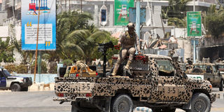 A Somali security officer holds position