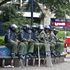 Anti-Riot police officers seated at the Hilton Square along Moi Avenue 