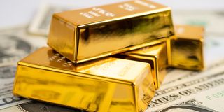 Gold bar on US dollar banknotes money